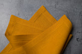 Canary linen fabric close-up with mitered hem corner – CoolLinen color 42. Canary