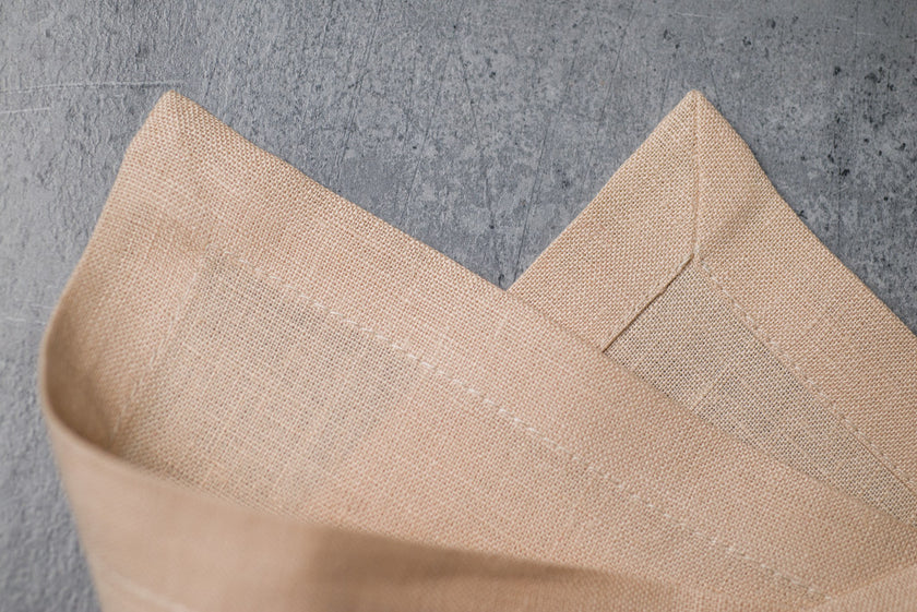 Sand linen fabric close-up with mitered hem corner – CoolLinen color 45. Sand