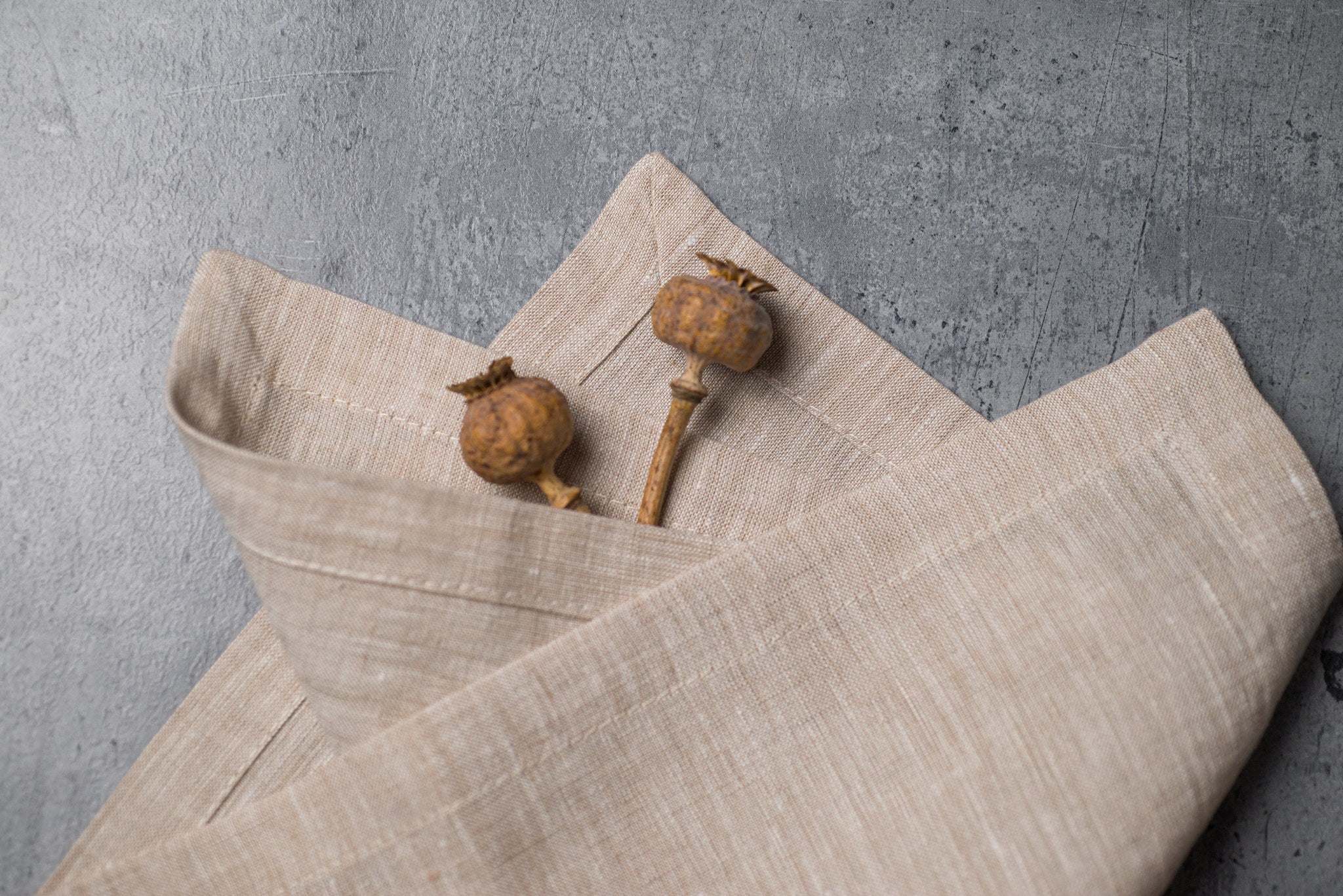 Natural Beige linen fabric close-up with mitered hem corner – CoolLinen color 46. Natural Beige