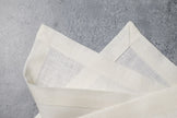 Milk linen fabric close-up with mitered hem corner – CoolLinen color 47. Milk