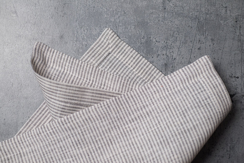 New Striped linen fabric close-up with mitered hem corner – CoolLinen color 48. New Striped