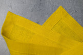 Lemon linen fabric close-up with mitered hem corner – CoolLinen color 50. Lemon