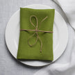 Pear linen napkin tied with jute twine on a white plate