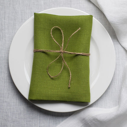 Pear linen napkin tied with jute twine on a white plate