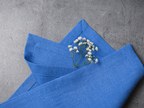 Electric linen fabric close-up with mitered hem corner – CoolLinen color 57. Electric