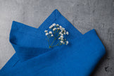 Electric linen fabric close-up with mitered hem corner – CoolLinen color 57. Electric