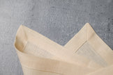 Cream linen fabric close-up with mitered hem corner – CoolLinen color 61. Cream