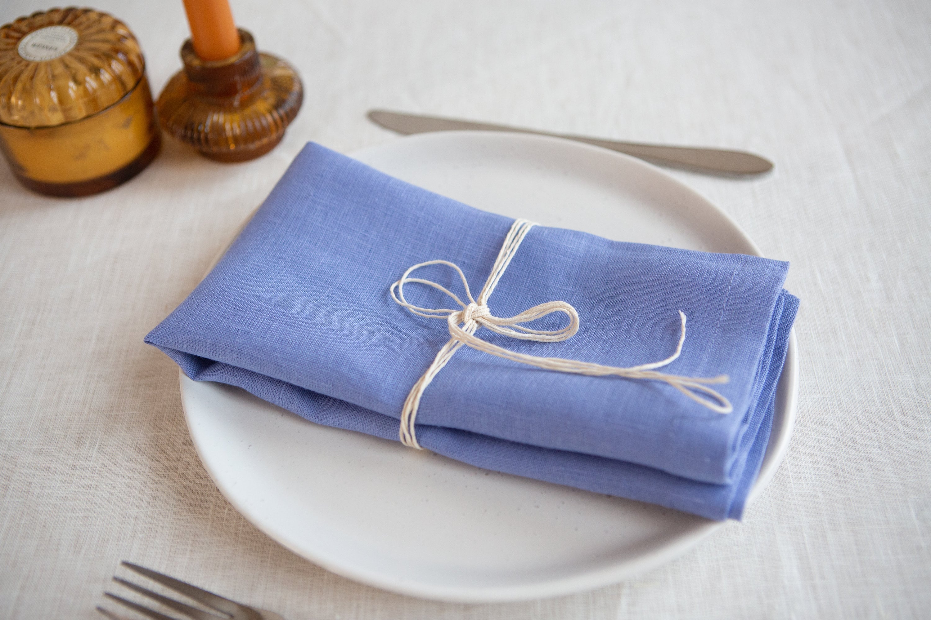 These linen napkins in bluet color with mitered corners offer both elegance and practicality. The bluet hue, reminiscent of a serene sky, adds a touch of tranquility to any table setting. The high-quality linen fabric provides a luxurious and soft texture, while the meticulously crafted mitered corners showcase attention to detail and precision.