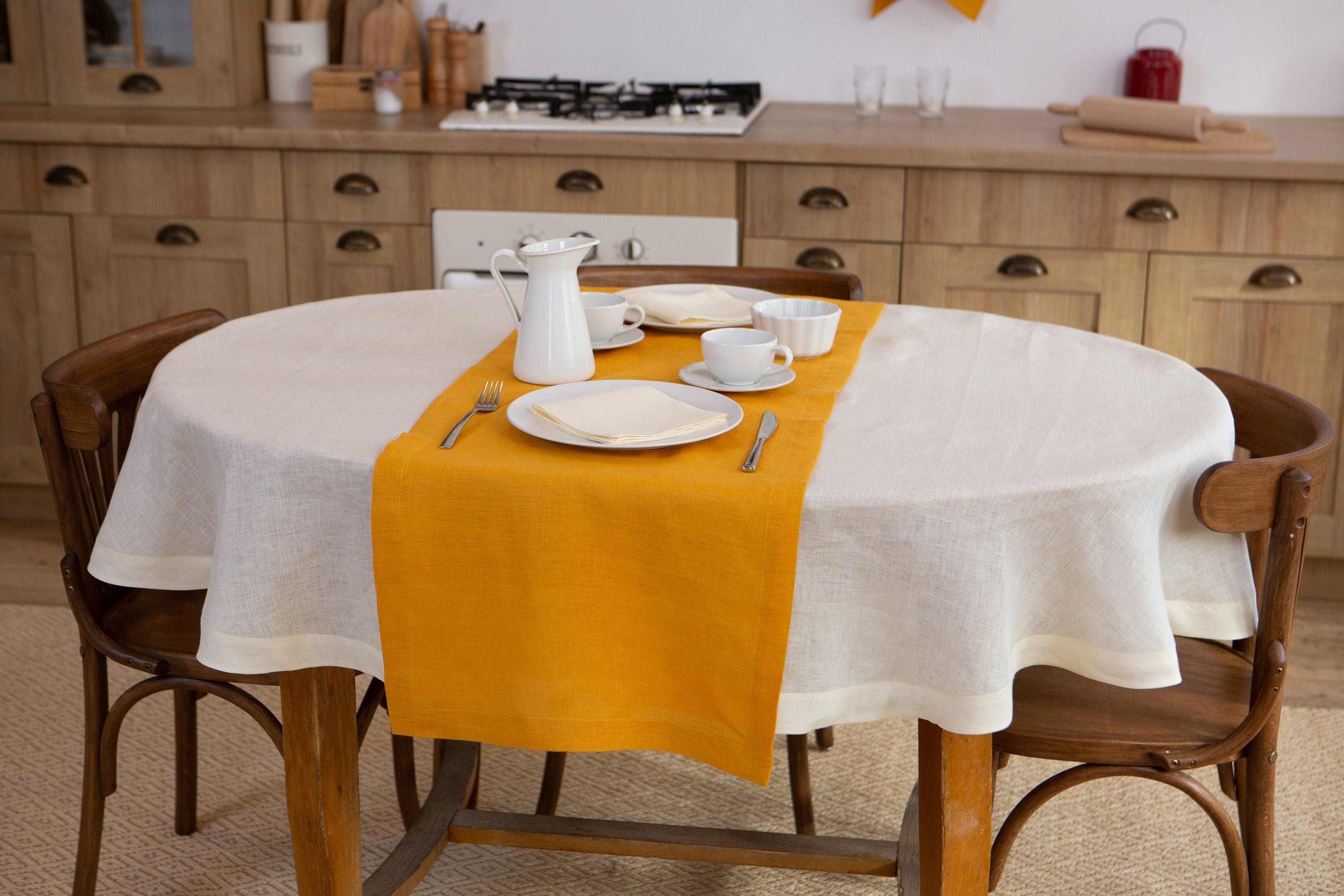 Oval linen tablecloth on a dining table