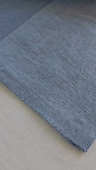 Light blue shade linen placemats made from natural flax, zero-waste table linens for eco-friendly table styling.