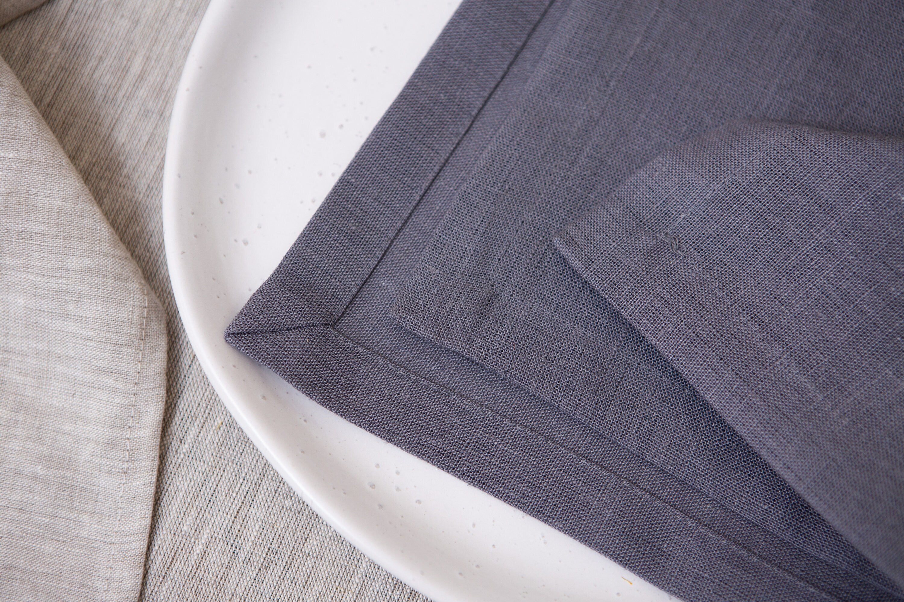 You can see the quality of the mitered corners on the linen napkins. The color of the napkin is Grey №3.